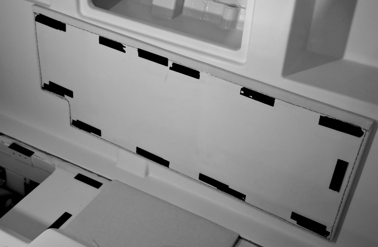 Excessive Velcro tape used on yacht interior panels showing inefficient and uncontrolled material application before process optimization.